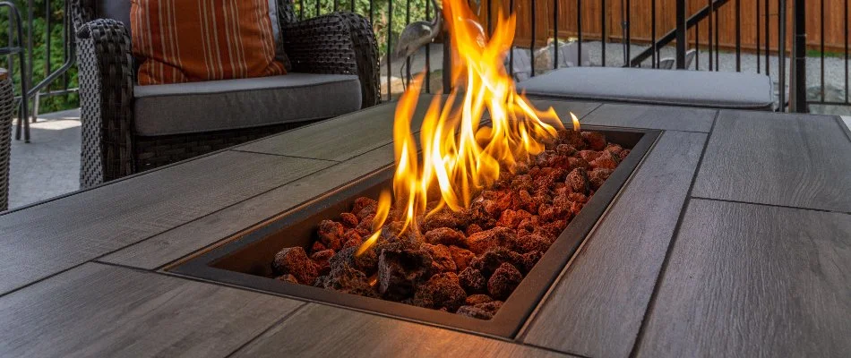 Fire table with an active flame in Chevy Chase, MD. 