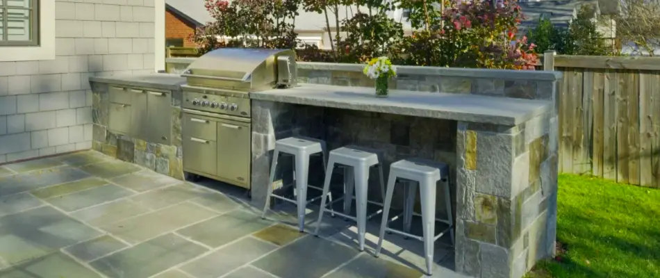Outdoor kitchen with bar seating in Chevy Chase, MD.