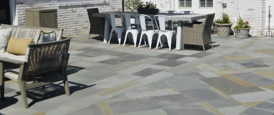 Patio in Chevy Chase, MD, with table and chairs.