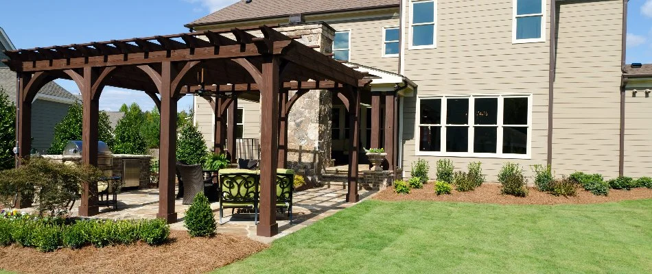 Wooden pergola in the backyard of a property in Chevy Chase, MD.