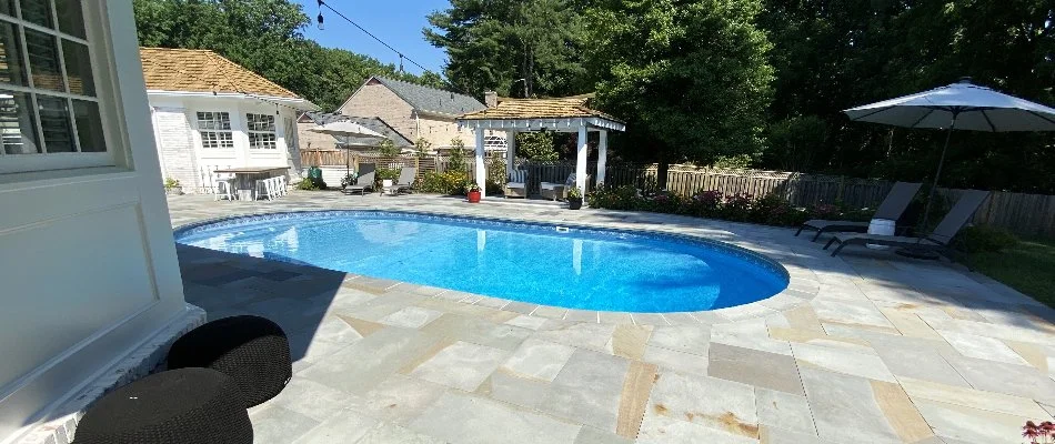 Swimming pool and deck on a property in Great Falls, VA.