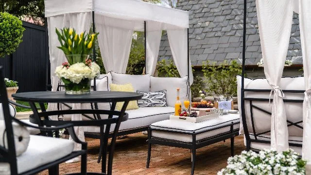 White cabanas and seating in outside area.